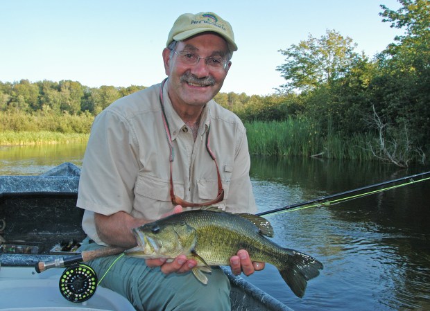 Fly anglers who enjoy smallmouth bass fishing, like Wayne Andersen shown fishing Hamlin Lake, will be able to target them all year under the expanded catch-and-immediate-release season proposed. Photo: Howard Meyerson.